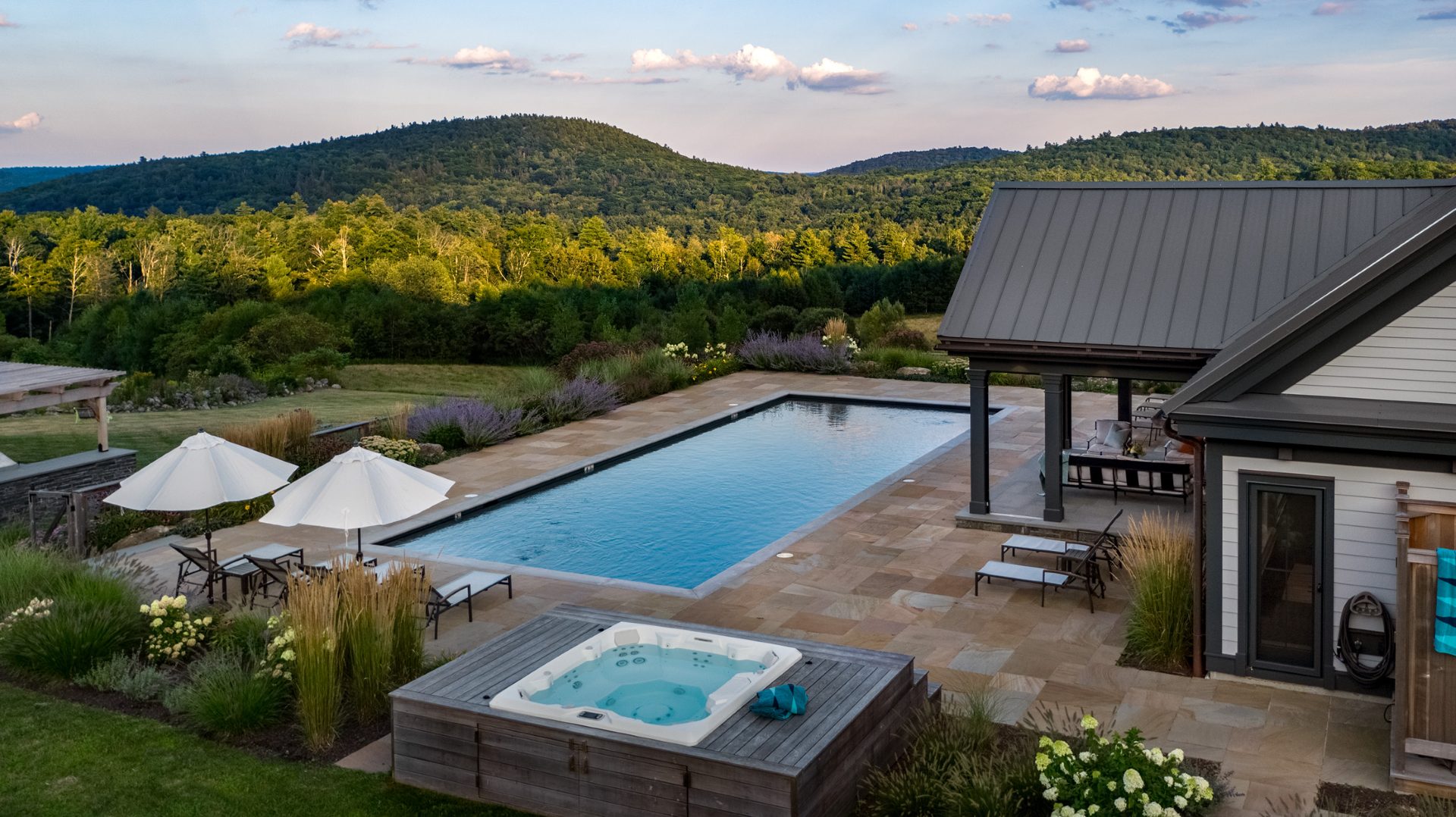 Poolside terrace overlooking the Berkshire hills at golden hour
