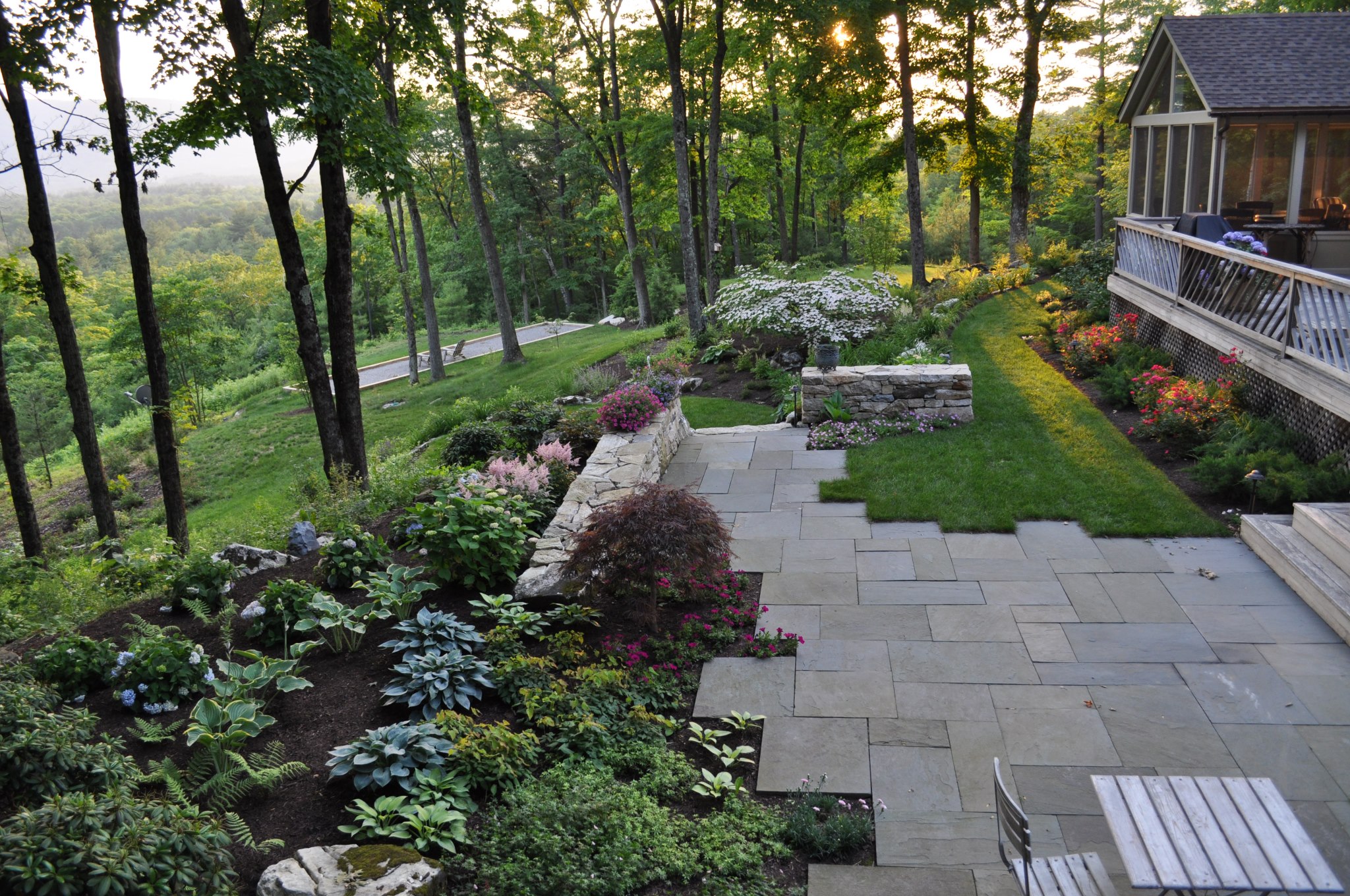Stone terrace and gardens at the Bernstein residence