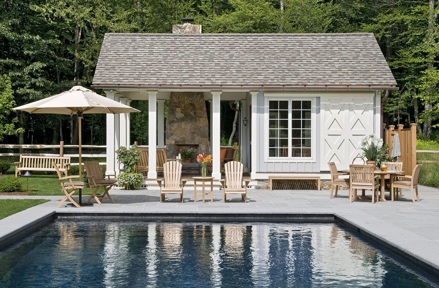 Poolside pavilion reflected in a still pool
